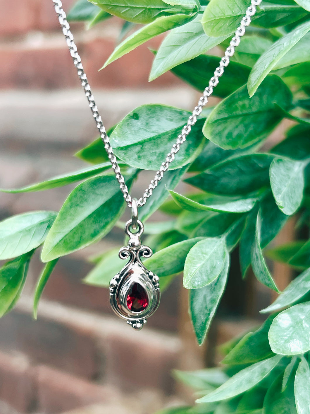 John Hiras: Pear Shaped Garnet Necklace